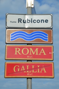 Street signs marking the limit of Julius Caesar’s province, Roman bridge over the Rubicon river, Savignano sul Rubicone, Italy. Image © Carole Raddato.