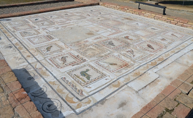 The Bird Mosaic consisting of a central panel surrounded by 35 small squares representing different species of birds, Italica. Image © Carole Raddato. 